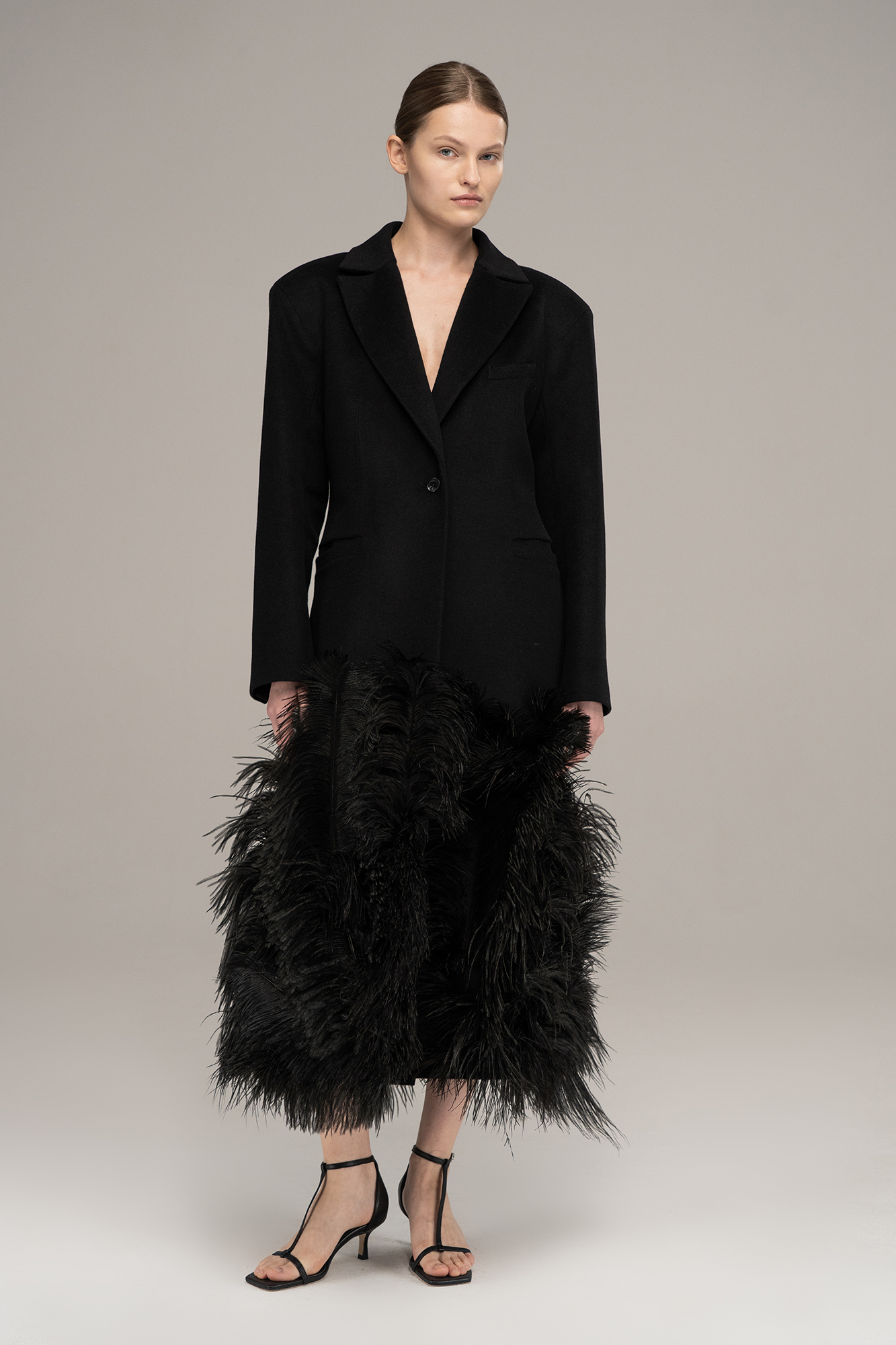 Coat with feathers